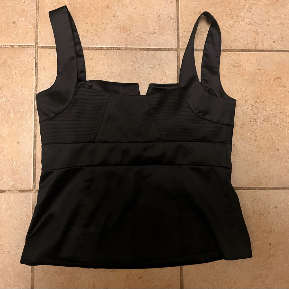 Size 8 black and white market corset like top with side zipper. Feels like silk.
